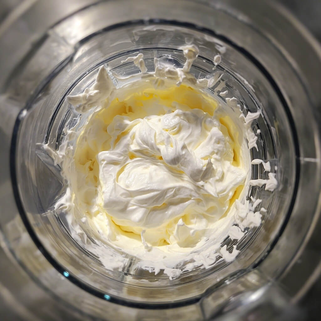 Blended keto cottage cheese dessert ingredients in blender